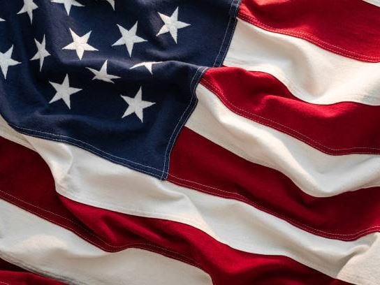 An American flag, its stars and stripes rippled.
